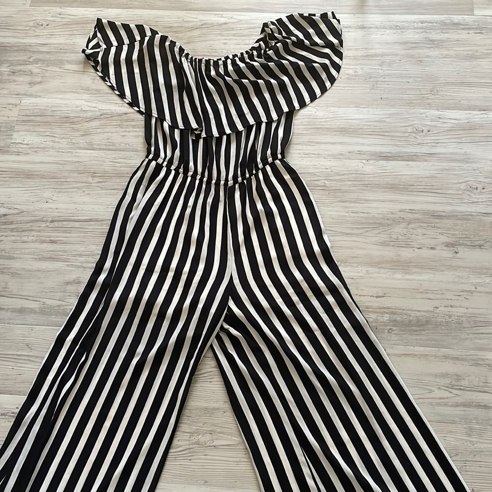 New York and Company striped jumpsuit with ruffle detail, size medium